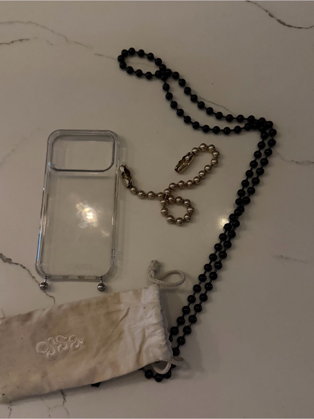 Ossa Clear 17 Pro IPhone Case with Black Beaded Long Strap and Gold Wrist Chain